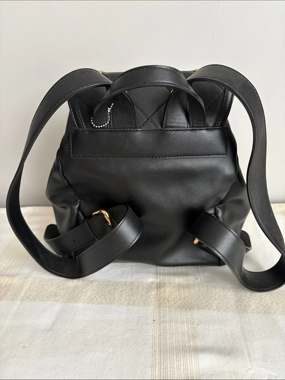 BNWOT Designer LOVE MOSCHINO Backpack, Faux Leather, with gold metal design.